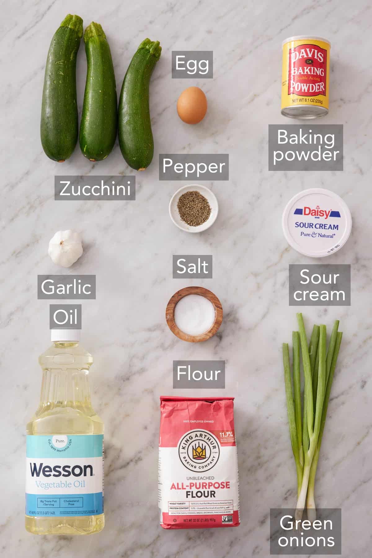 Ingredients needed to make zucchini fritters.