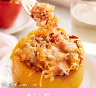 Pinterest graphic of a fork lifting up a bite of rice from the air fryer stuffed peppers.