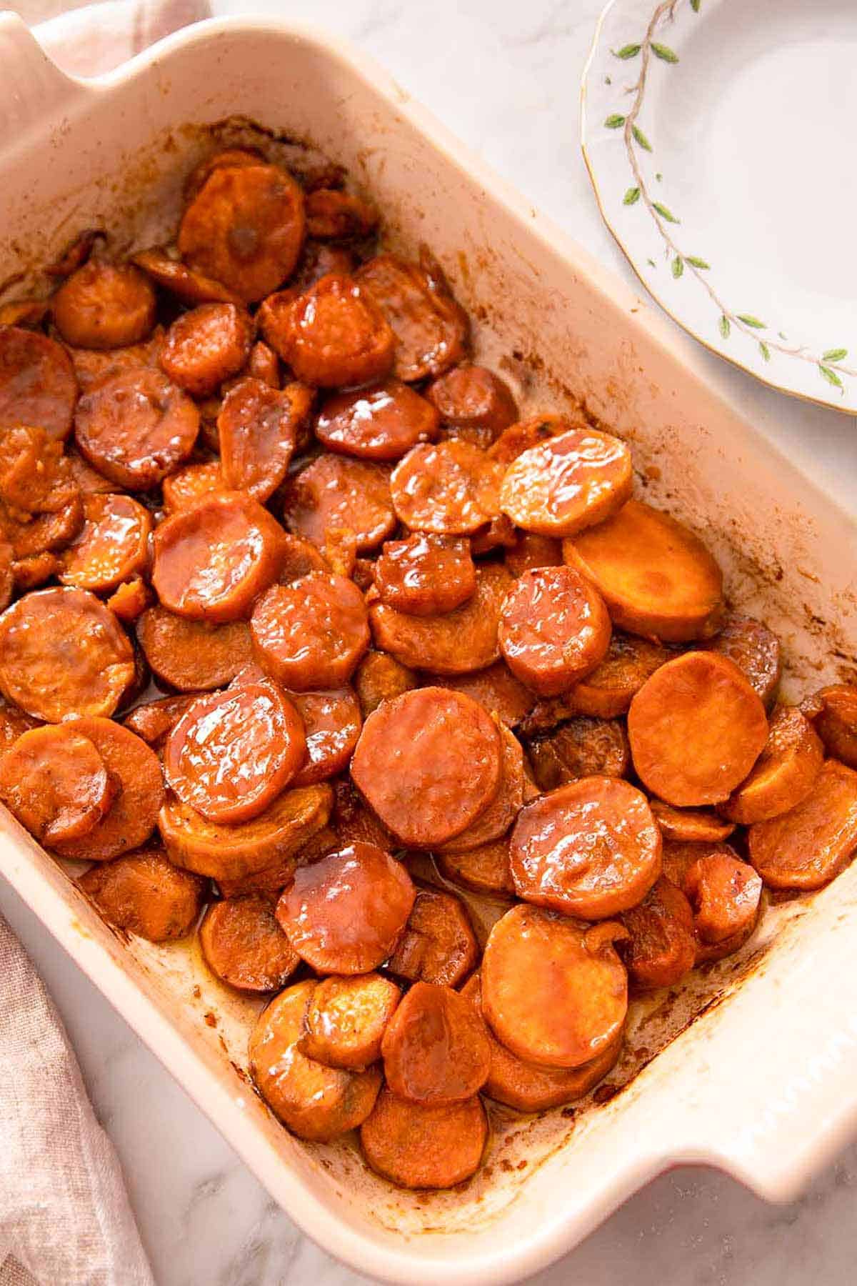 Overhead view of candied yams in a casserole dish.