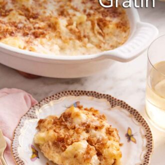 Pinterest graphic of a plate of cauliflower gratin with a baking dish in the background.