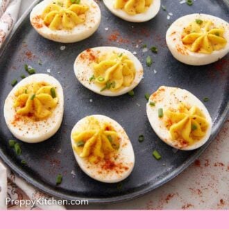 Pinterest graphic of a platter with deviled eggs topped with chives and paprika.