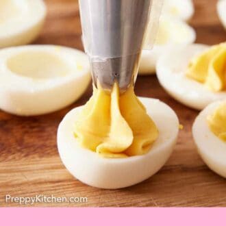 Pinterest graphic of deviled egg filling piped into egg whites.