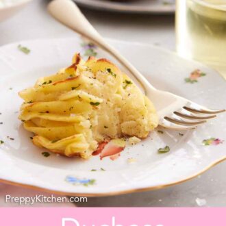 Pinterest graphic of a plate with a serving of duchess potato with a bite taken out. A fork on the plate.