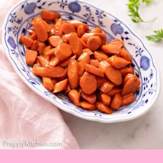Pinterest graphic of an oval platter of glazed carrots. Parsley and a napkin off to the side.