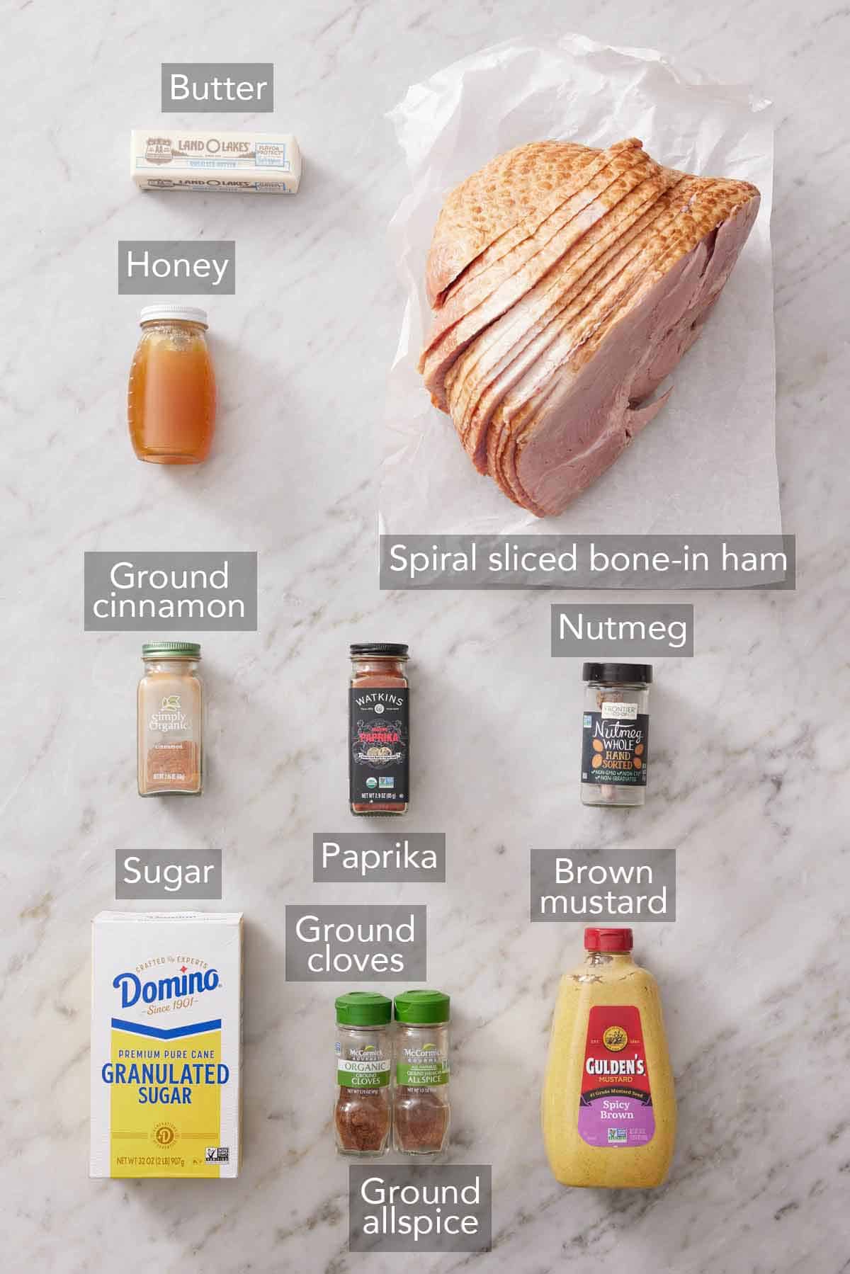 Ingredients needed to make a honey baked ham.