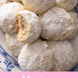Pinterest graphic of close up view of a platter of Mexican wedding cookies, one on top with a bite taken out.