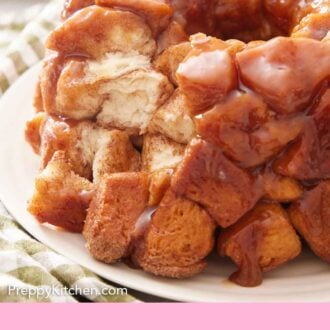 Pinterest graphic of monkey bread with a portion removed.