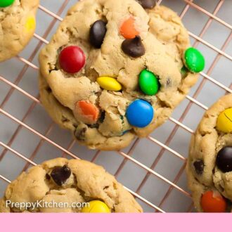 Pinterest graphic of an overhead view of monster cookies on a wire rack.