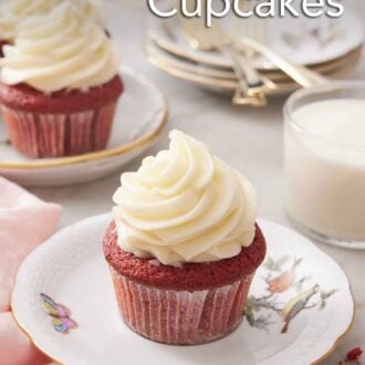 Pinterest graphic of a red velvet cupcake with a glass of milk in the back along with a few more cupcakes, plates, and forks.