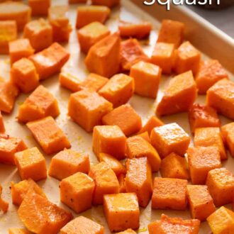Pinterest graphic of a sheet pan of roasted butternut squash. A small bowl of salt in the background.