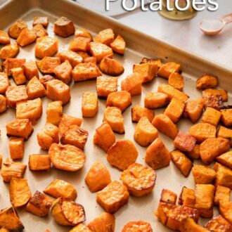 Pinterest graphic of a sheet pan of roasted sweet potatoes with a pepper grinder in the back and some salt.