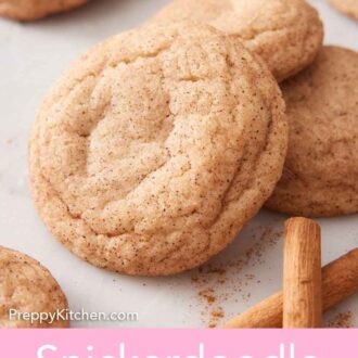 Pinterest graphic of snickerdoodle cookies in a small grouping with some cinnamon sticks and ground cinnamon scattered nearby.