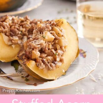 Pinterest graphic of a plate with a stuffed acorn squash cut in half with a glass of wine and additional squash in the background.