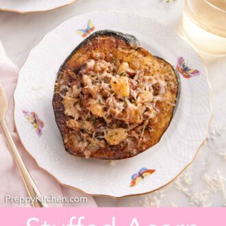 Pinterest graphic of a plate with a serving of stuffed acorn squash. Glass of wine and thyme in the background.