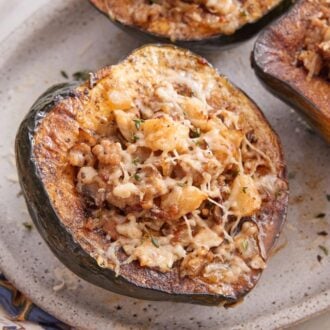 Overhead view of a platter with stuffed acorn squash.