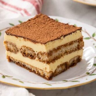 Tiramisu on a plate, showing the different layers.
