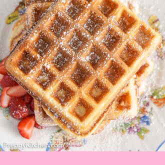 Pinterest graphic of an overhead view of a stack of waffles with powdered sugar dusted on top.