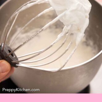 Pinterest graphic of whipped cream on the end of a whisk and a mixing bowl in the background.