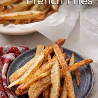 Pinterest graphic of a plate with air fryer french fries with a drink and more fries in the background.