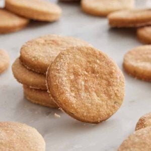 Multiple biscochitos with a stack in the middle with one leaning up against it.
