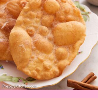 Pinterest graphic of a close up view of a plate of bunuelos.