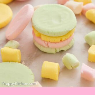 Pinterest graphic of multiple round shaped butter mints stacked with more around it.