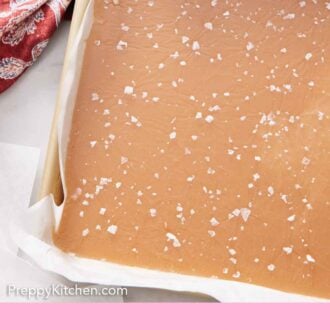 Pinterest graphic of caramel on a sheet pan before being cut, topped with flaky sea salt.