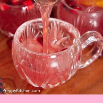Pinterest graphic of Christmas punch poured into a glass.