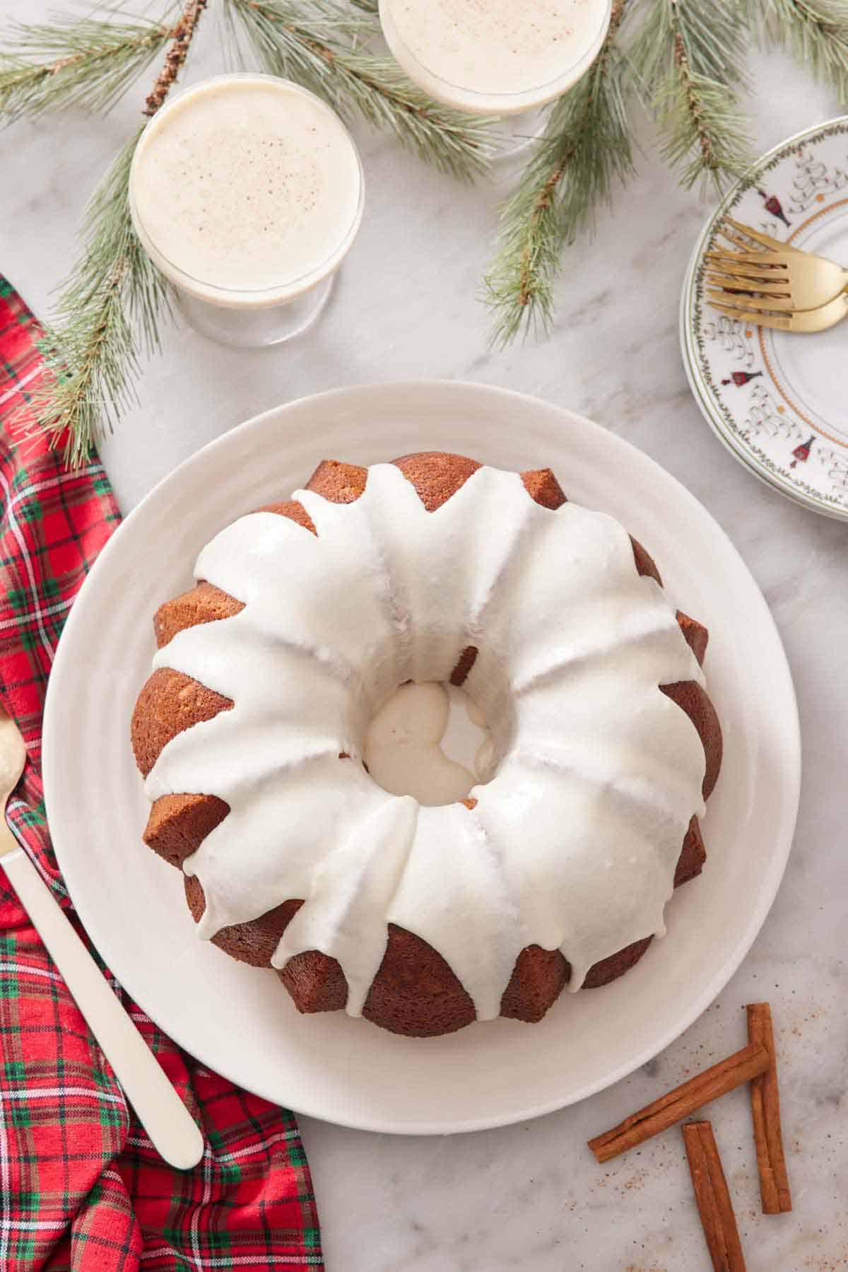 An overhead view of an eggnog cake topped with icing.