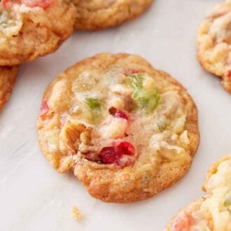Fruitcake cookies on a marble surface.