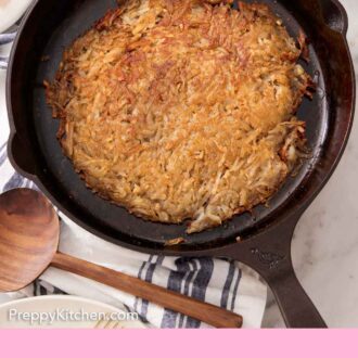 Pinterest graphic of an overhead view of hash browns on a cast iron skillet. Some ketchup off to the side.