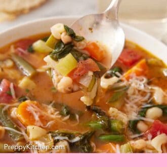 Pinterest graphic of a spoon lifting minestrone soup out of a bowl.