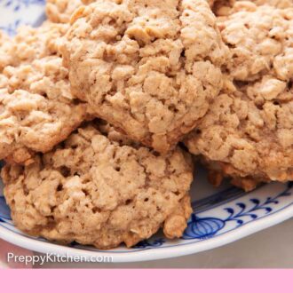 Pinterest graphic of a close up view of oatmeal cookies on a platter.