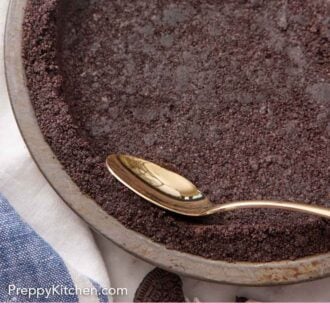 Pinterest graphic of an Oreo pie crust in a pie pan with a spoon pressing the edge.