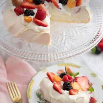 Pinterest graphic of a plate with a slice of pavlova topped with berries with the rest of the pavlova on a clear cake stand.