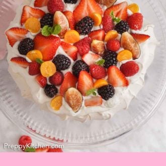 Pinterest graphic of an overhead view of a pavlova on a cake stand with fresh berries on top.