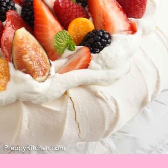 Pinterest graphic of a close up view of a pavlova topped with fresh berries.