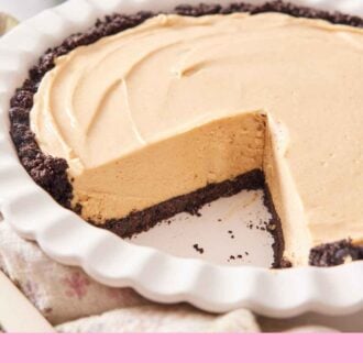 Pinterest graphic of a peanut butter pie in a white baking dish with a slide taken out. Angle showing the interior of the pie.