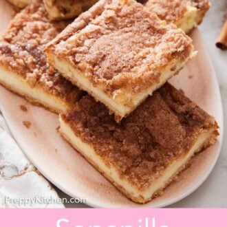 Pinterest graphic of a platter of sopapilla cheesecake cut into squares with a stack of plates in the background.