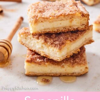 Pinterest graphic of a stack of three sopapilla cheesecake slices with honey drizzling down.