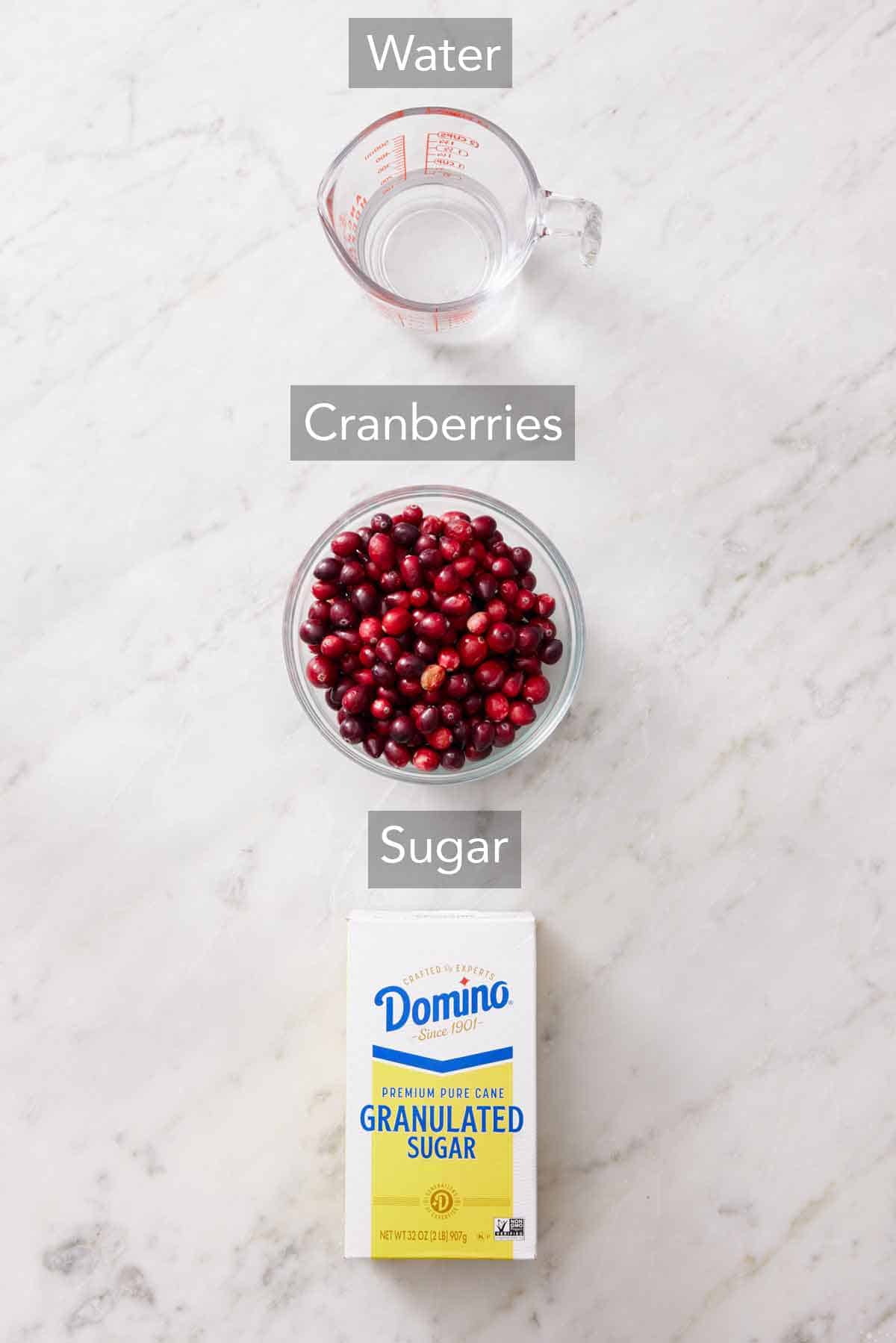 Ingredients needed to make sugared cranberries.