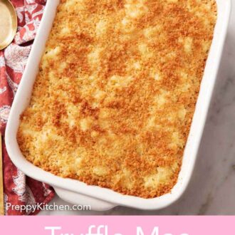 Pinterest graphic of an overhead view of truffle mac and cheese in a white baking dish.