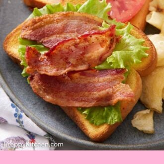 Pinterest graphic of a plate with air fryer bacon on a piece of toast with lettuce.