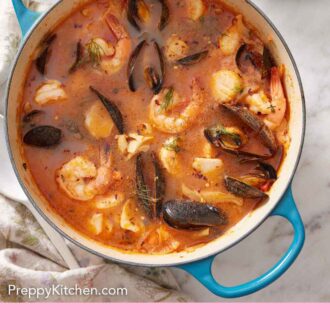 Pinterest graphic of bouillabaisse in a large pot with a bowl of rouille and bread off to the side.