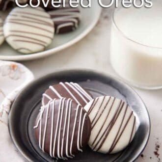 Pinterest graphic of a plate with three chocolate covered oreos with a glass of milk and more oreos on a platter in the background.