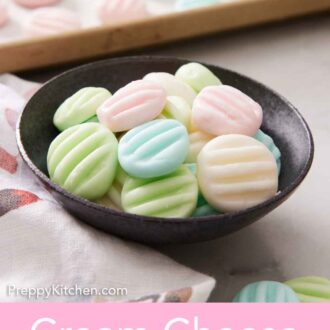 Pinterest graphic of a bowl of cream cheese mints with a sheet pan with more in the background.