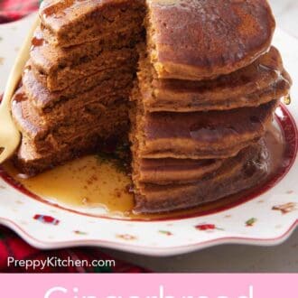 Pinterest graphic of a stack of gingerbread pancakes with a portion cut out. Butter and syrup on top.