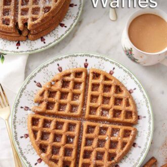 Pinterest graphic of overhead view of a large gingerbread waffle. A stack of waffles in the background along with a coffee and stick of butter.