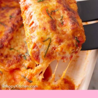 Pinterest graphic of manicotti lifted from a baking dish.