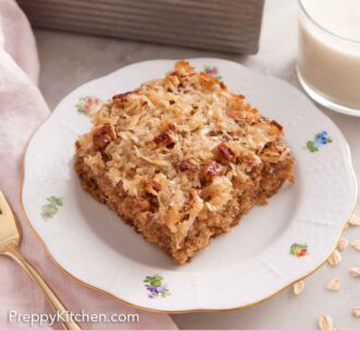 Pinterest graphic of plate with a piece of oatmeal cake with the baking dish in the background.